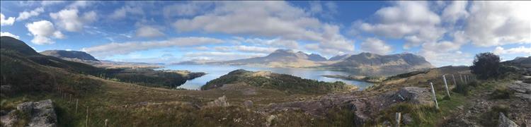 A very wide angle shot of the wild and vast highland scenery
