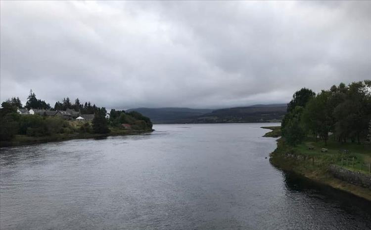 The river has widened out into the loch