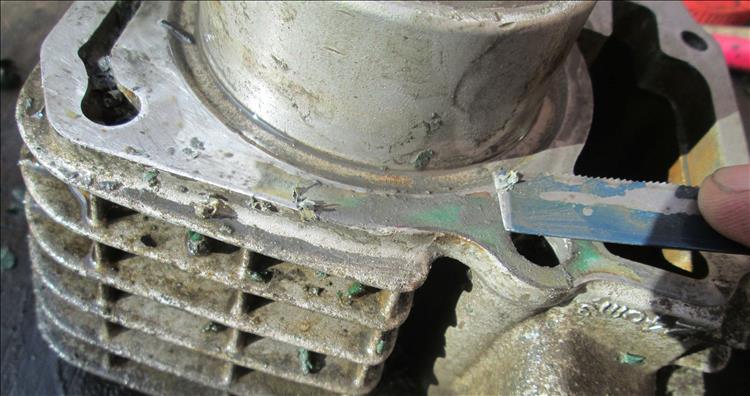 Scaping bits of very stuck on gasket from the base of the barrel