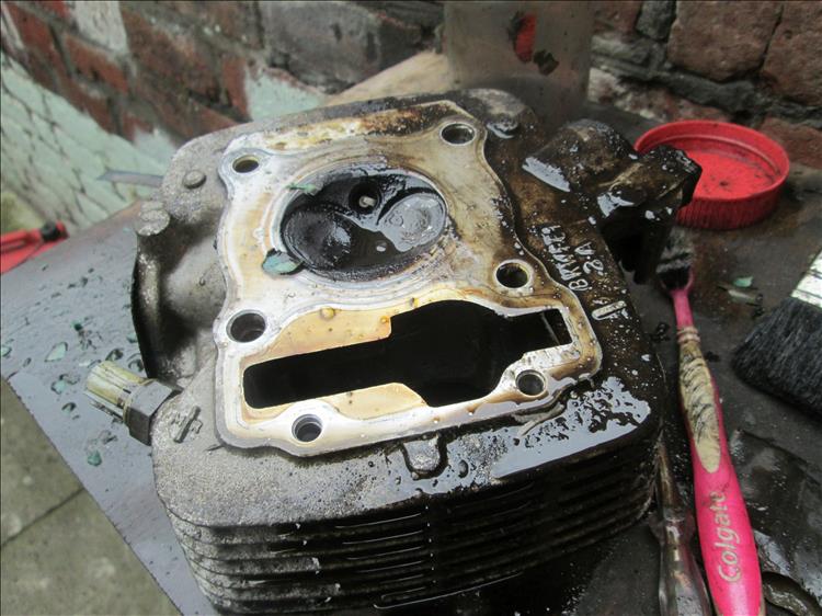 Cleaning years of dirt off the aged cylinder head