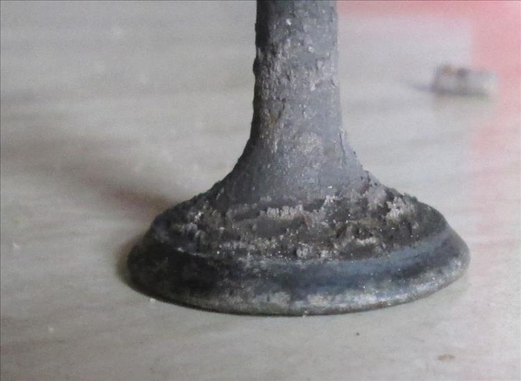 The valve has a step in it where it meets the seat
