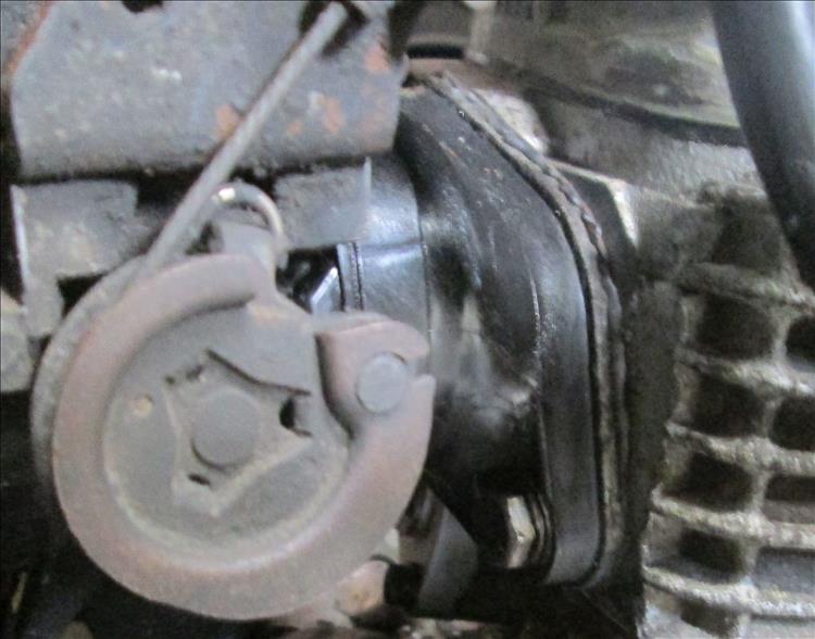 The gasket is sanwiched between the inlet tract and the cylinder head