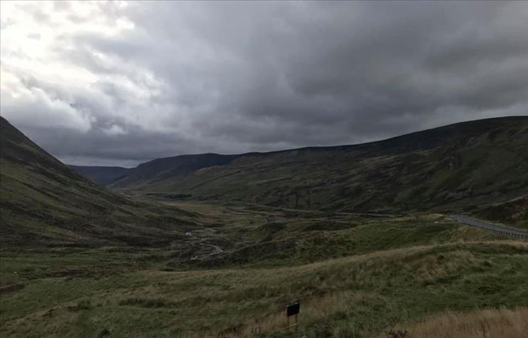More vast bulbous mountains and the road snaking between the undulations near Glanshee