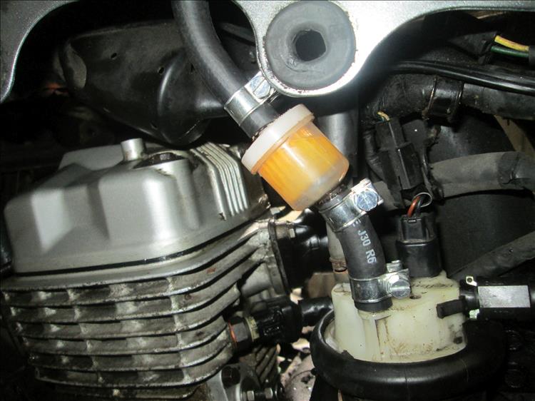 The new fuel pipe is held in place with clamps