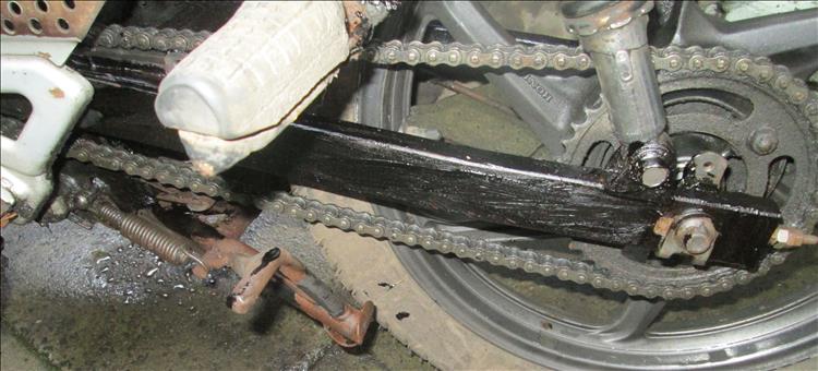 The left swingarm covered in more underseal