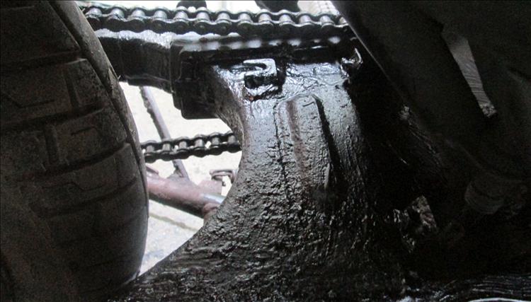 The top of the swingarm treated with the underseal