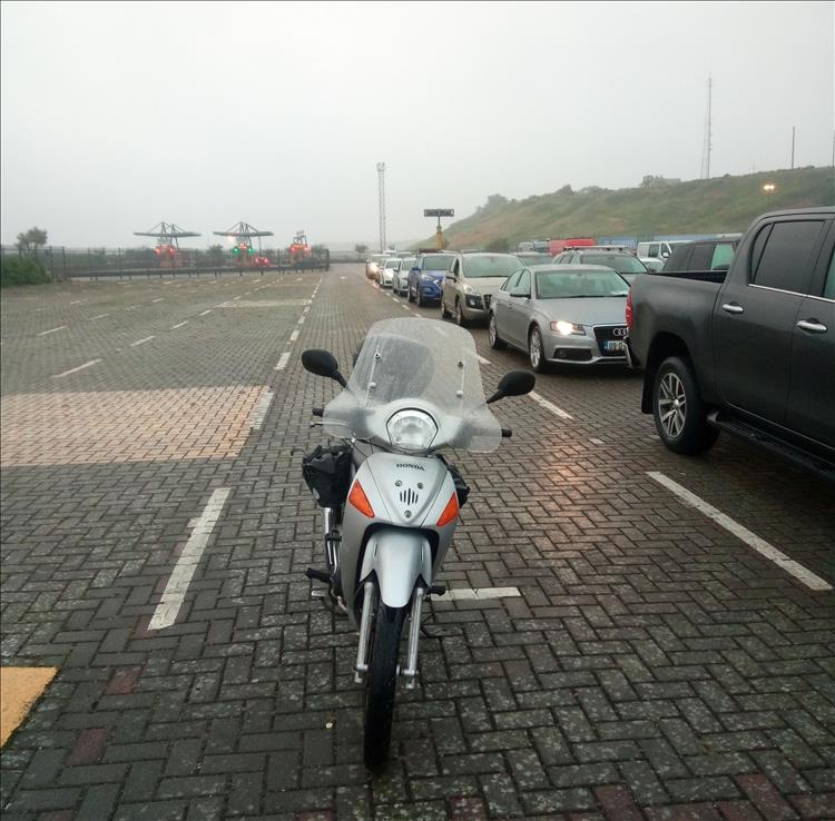 Rev. Mick's Honda innova at the head of a line at the misty moist Rosslare harbour