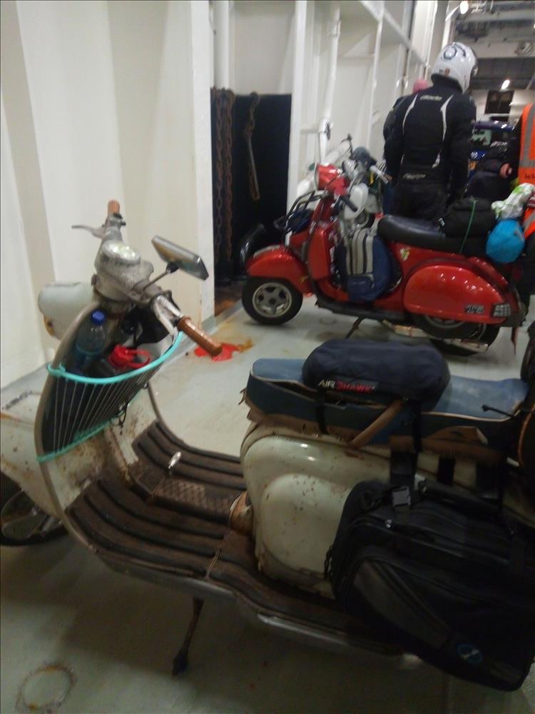 Scooters with luggage strapped down on the ferry