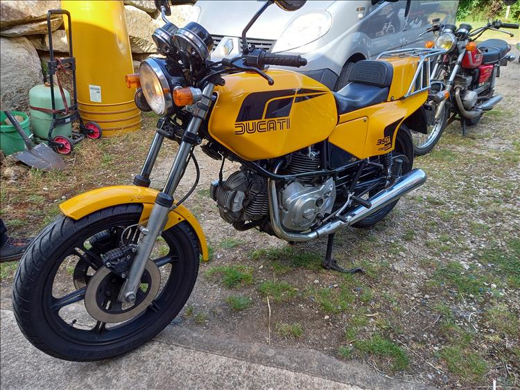 A mint condition Ducati 350 Desmo in vivid yellow