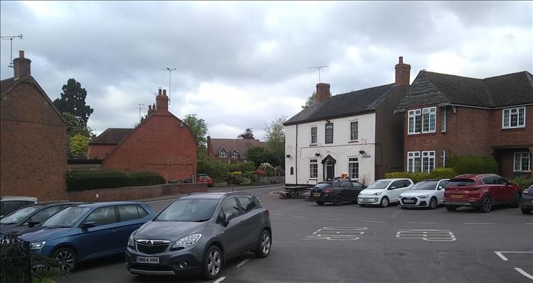 The village of Long Itchington with pleasant houses and a pub