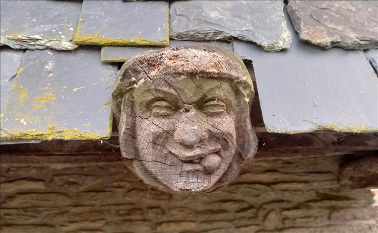 Another wooden sculptured face this one sticking it's tongue out
