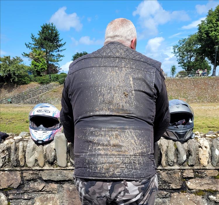 The back of Rik's jacket is covered in mud and cow manure