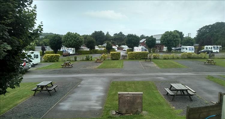 Smart hardstanding, a few trees, cut grass and pleasant surroundings at the campsite