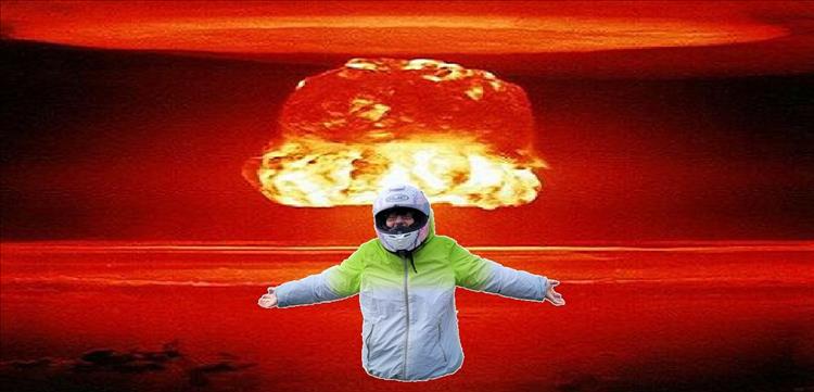 A bright orange nuclear mushroom with Sharon digitally dropped into the image