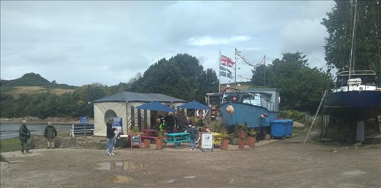 An old boat and some awning make up the cafe at Watermouth Bay
