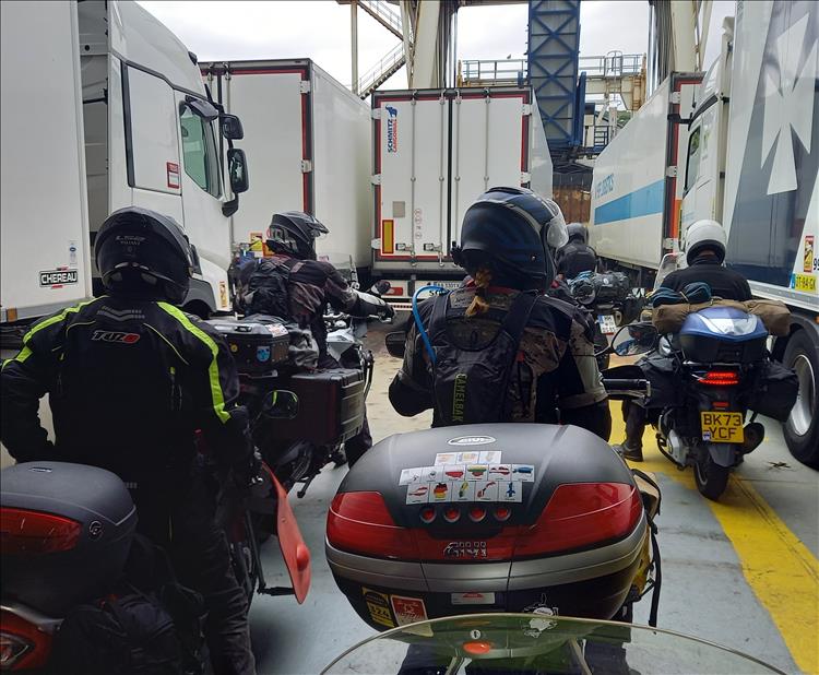 Between trucks and vans a collection of riders sat on their bikes on the Dunkirk ferry