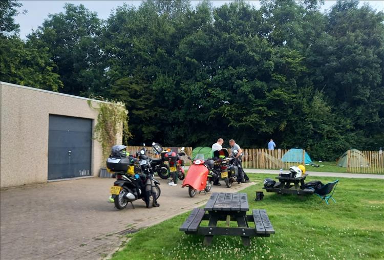 The lads are loading the bikes with their camping kit at the campsite