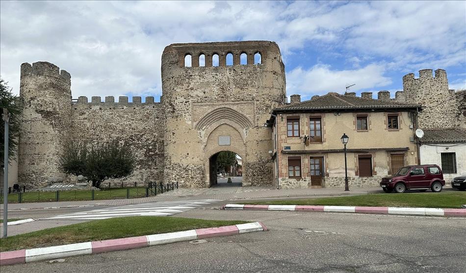 The gatehouse with archway and modern roads out front