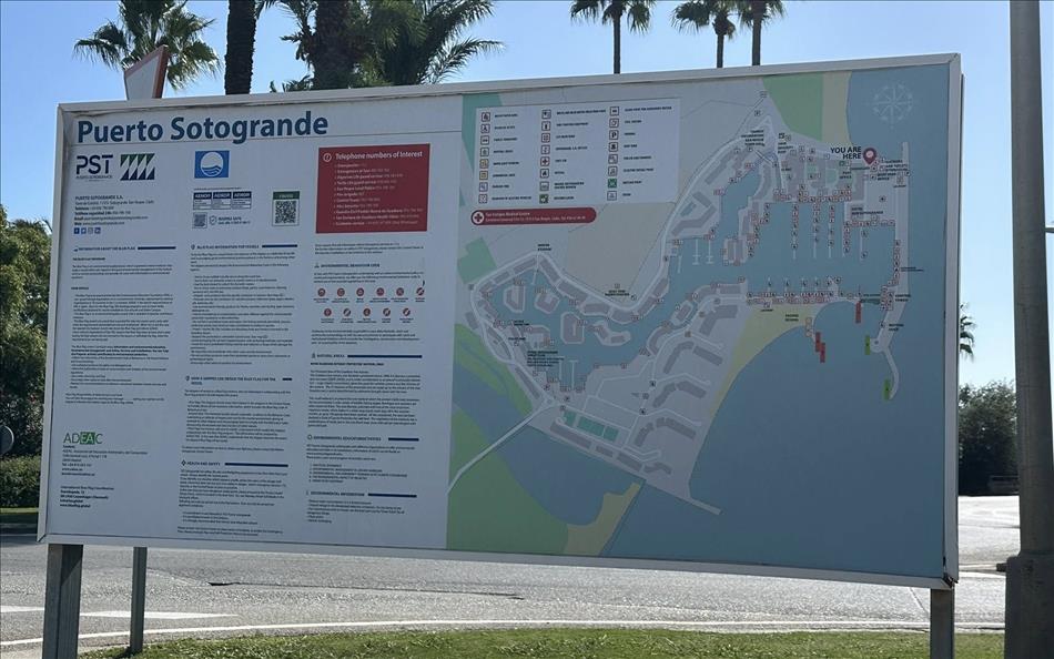 A sign with Puerto Sotogrande woring and a map of the layout of the area