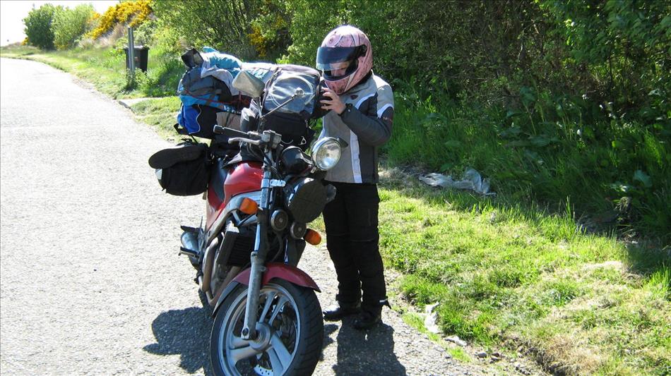 Sharon, a narrow highland lane, Ren's old NTV650 with luggage