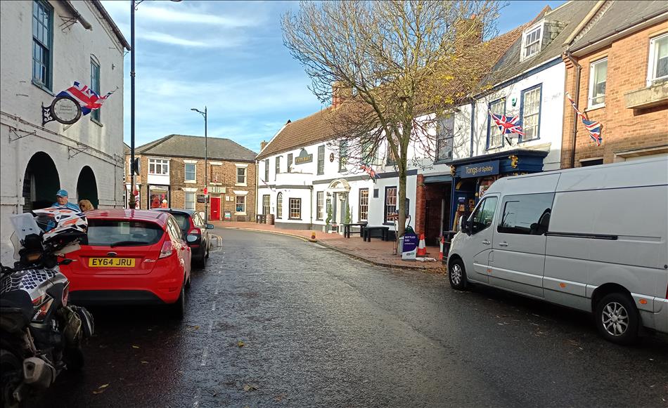 A few building and shops, a regular small town centre street