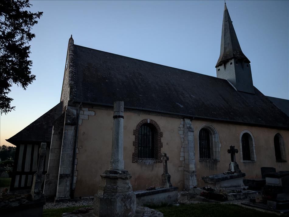 The nearby church in the darkening evening sky