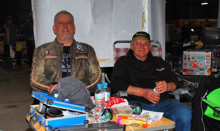 Pete Johnson sits and rests with Ian Coates on the stand