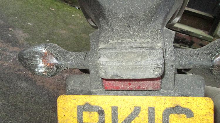 The thick layer of salt and dirt over the number place and tail light of the 500