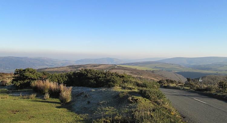 Rolling hills mixed with steep valleys in glorious winter sun at exmoor