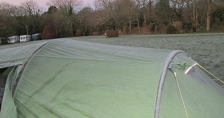 The tent has frost and ice upon it at the frozen campsite in Cornwall