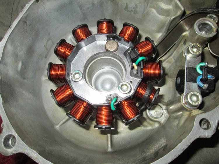 The new stator is fitted inside the crankcase and ready to go back on the bike