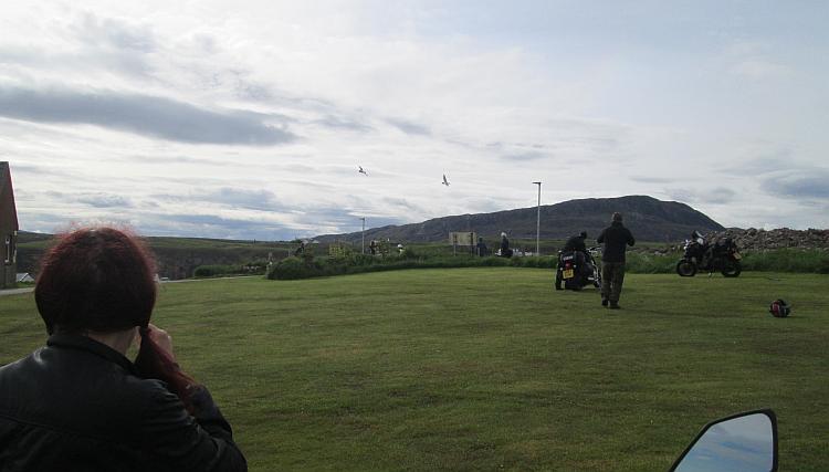 Sharon looks across the slippery grass at the campsite in Durness