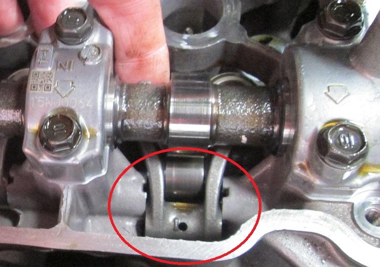 The follower can be moved back to access the shims