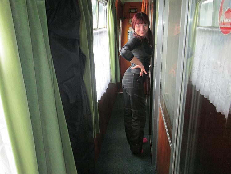 Sharon puts on a sexy pose in the corridor of the carriage at sleeperzzz