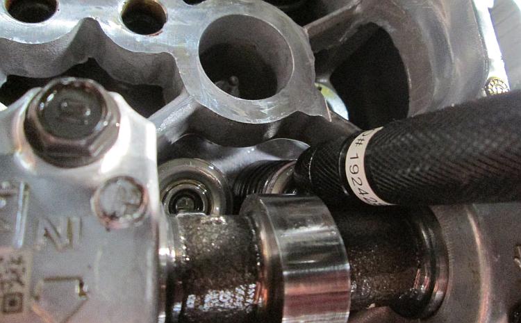 A manget on a torch is used to remove the tiny little shims